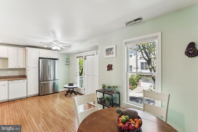 3814 Woodlawn Ct, Alexandria, VA 22304 - dining room with a ceiling fan, visible vents, plenty of natural light, and light wood finished floors