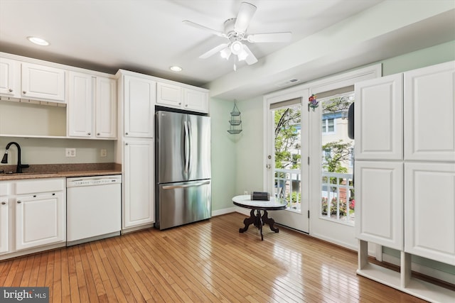 3814 Woodlawn Ct, Alexandria, VA 22304 - kitchen featuring freestanding refrigerator, white cabinetry, light wood finished floors, and dishwasher