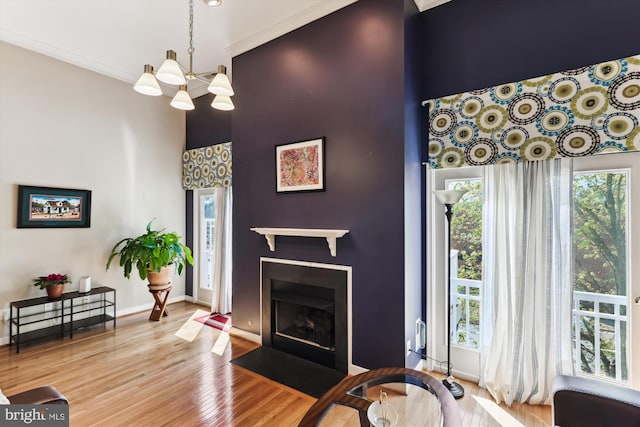 3814 Woodlawn Ct, Alexandria, VA 22304 - living area with a high ceiling, a chandelier, wood finished floors, and a wealth of natural light