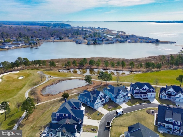 drone / aerial view with a residential view and a water view
