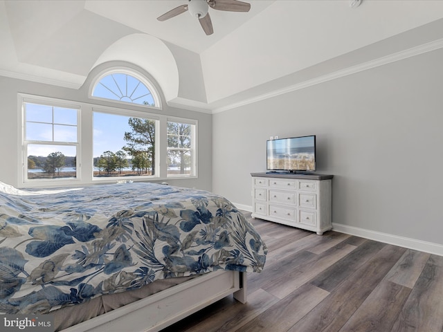 bedroom with baseboards, lofted ceiling, dark wood-style floors, and a ceiling fan