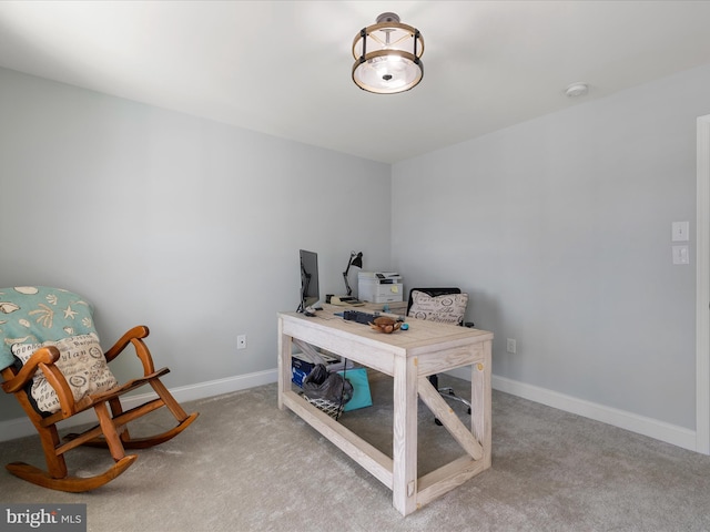 carpeted home office with baseboards