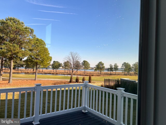 wooden deck featuring a water view