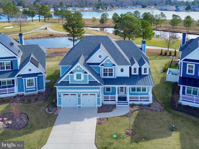 birds eye view of property featuring a water view