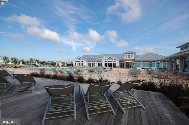 wooden terrace featuring a community pool