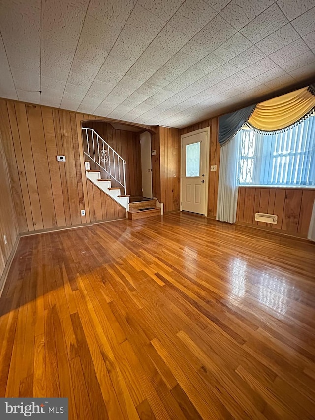1224 Sheridan Ave, Baltimore, MD 21239 - interior space with stairway, wood walls, and hardwood / wood-style flooring