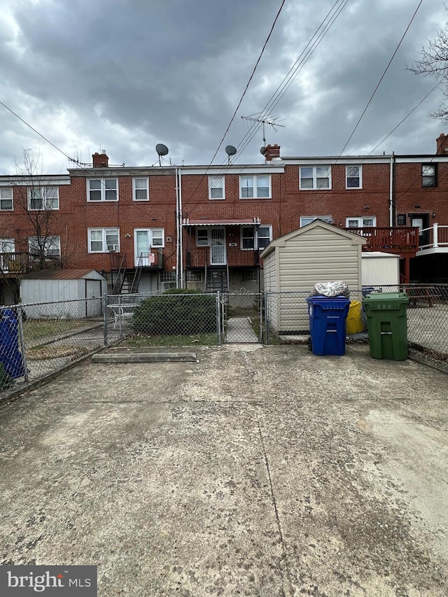 1224 Sheridan Ave, Baltimore, MD 21239 - back of house with a gate and fence