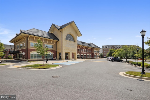view of property with uncovered parking