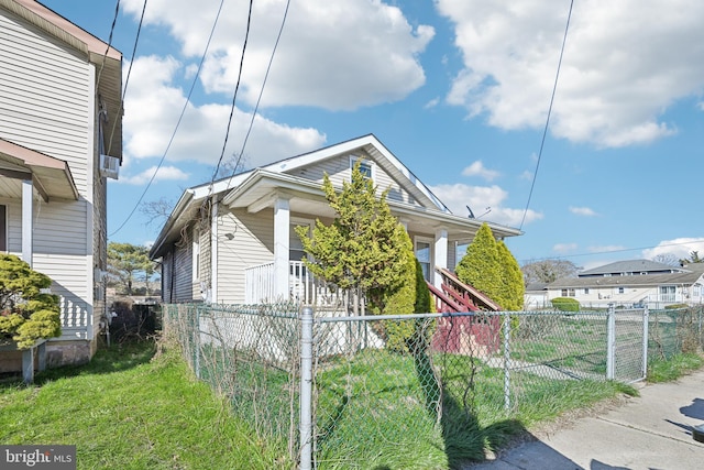 view of home's exterior with fence private yard and a yard