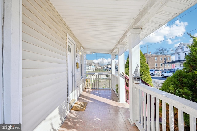 exterior space featuring a residential view and a porch