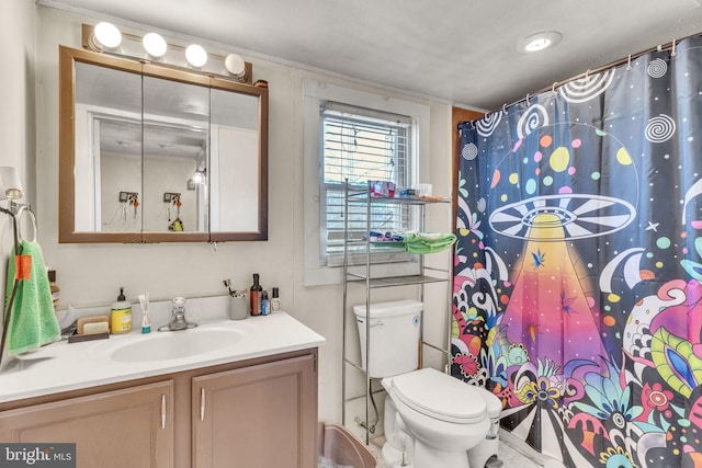 bathroom with toilet, vanity, and a shower with shower curtain
