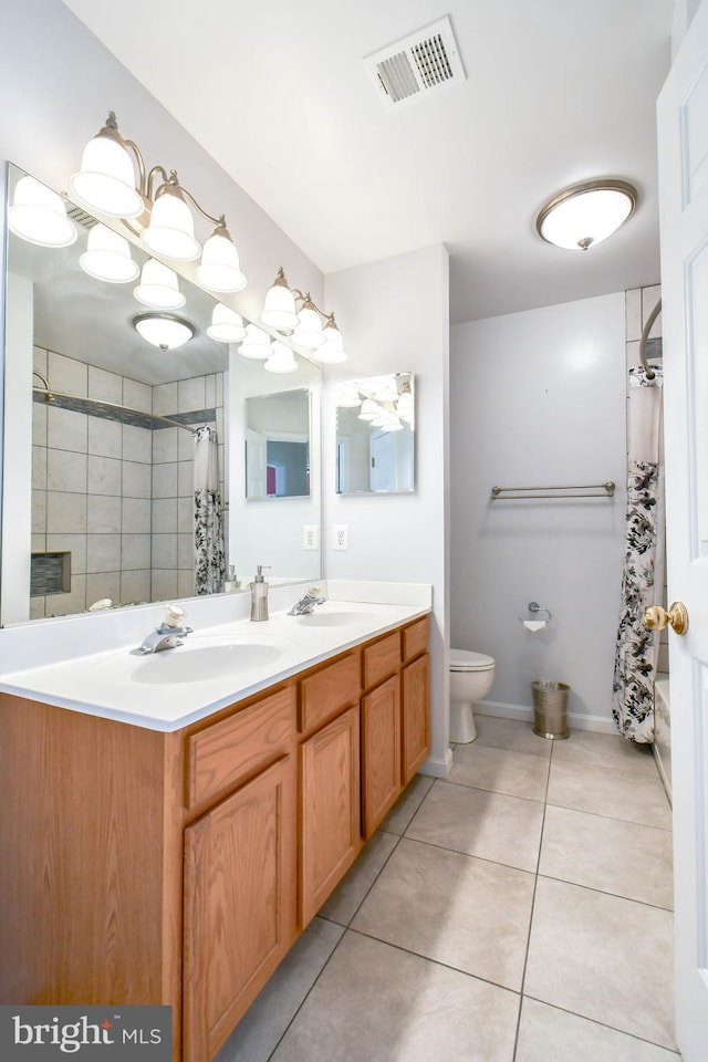 full bath with toilet, tile patterned floors, a sink, and visible vents