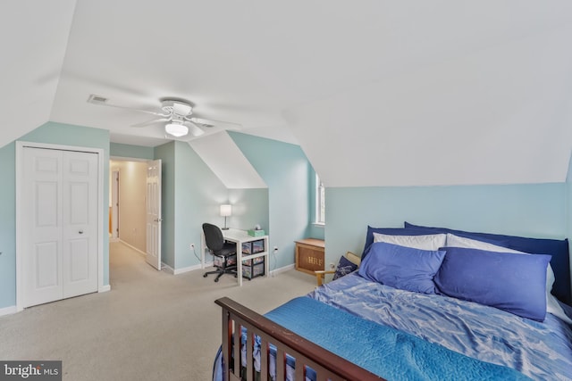 carpeted bedroom with visible vents, vaulted ceiling, baseboards, and ceiling fan