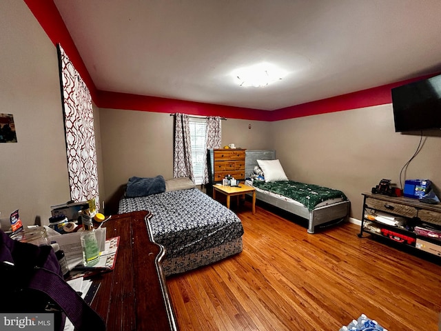 bedroom with wood finished floors