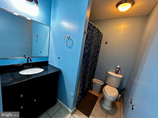 full bath with vanity, toilet, and tile patterned flooring