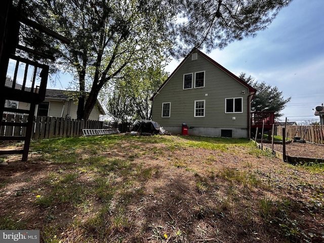 back of property with fence