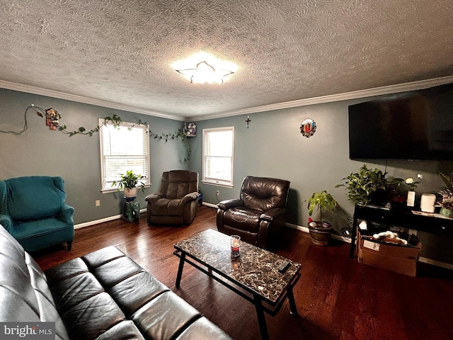 living area with baseboards, wood finished floors, a textured ceiling, and crown molding