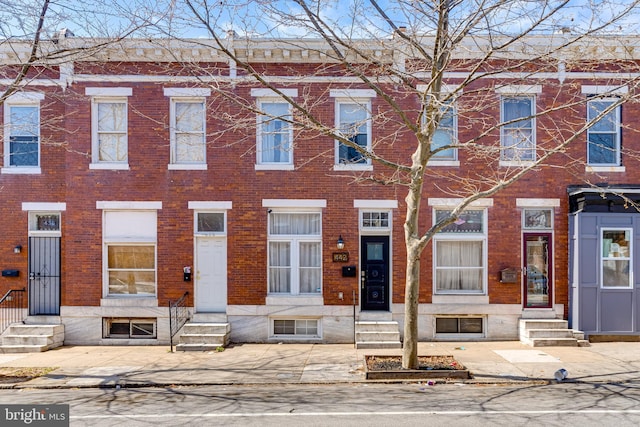 442 N Linwood Ave, Baltimore, MD 21224 - townhome / multi-family property with brick siding and entry steps