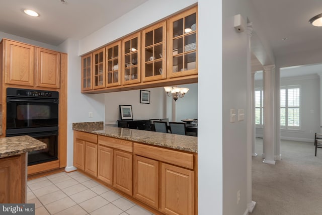 2804 Persimmon Pl Unit D3, Cambridge, MD 21613 - kitchen with dobule oven black, glass insert cabinets, stone counters, light carpet, and light tile patterned flooring