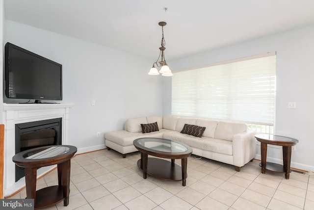 2804 Persimmon Pl Unit D3, Cambridge, MD 21613 - living room with a glass covered fireplace, baseboards, and light tile patterned flooring