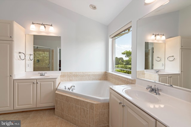 2804 Persimmon Pl Unit D3, Cambridge, MD 21613 - bathroom featuring a shower stall, a garden tub, vaulted ceiling, and a sink