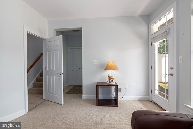 2804 Persimmon Pl Unit D3, Cambridge, MD 21613 - living area featuring baseboards, stairway, and carpet