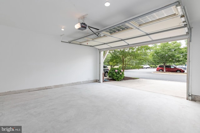 2804 Persimmon Pl Unit D3, Cambridge, MD 21613 - garage featuring a garage door opener and baseboards