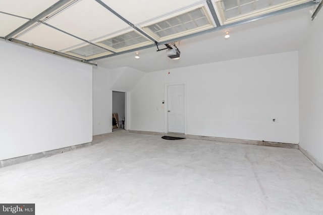 2804 Persimmon Pl Unit D3, Cambridge, MD 21613 - garage featuring a garage door opener and baseboards