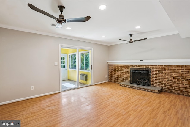 19916 Westerly Ave, Poolesville, MD 20837 - unfurnished living room with ceiling fan, wood finished floors, a brick fireplace, ornamental molding, and recessed lighting