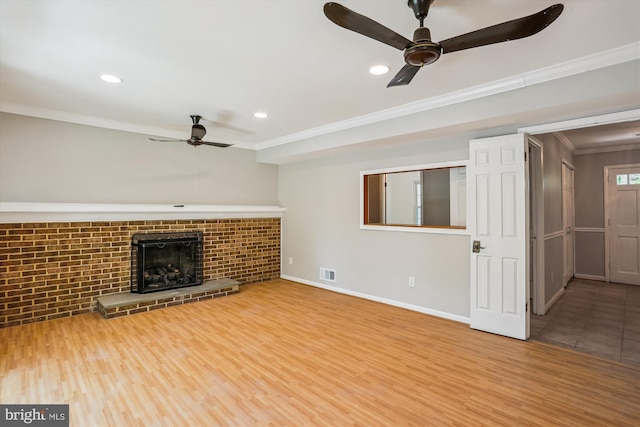 19916 Westerly Ave, Poolesville, MD 20837 - unfurnished living room with ceiling fan, crown molding, a brick fireplace, wood finished floors, and recessed lighting