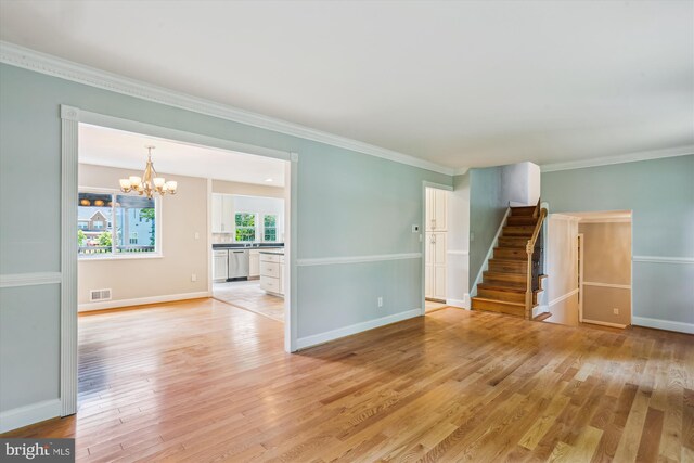19916 Westerly Ave, Poolesville, MD 20837 - unfurnished living room with a chandelier, light wood-style floors, stairway, and crown molding