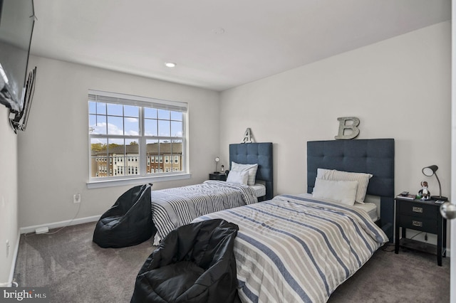carpeted bedroom with baseboards