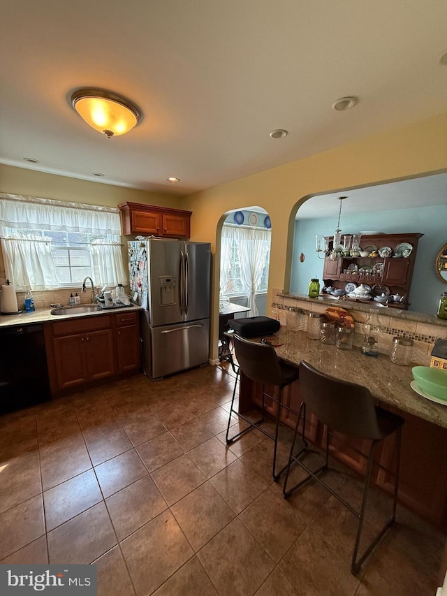 2703 Branch Pike, Cinnaminson, NJ 08077 - kitchen featuring stainless steel fridge with ice dispenser, arched walkways, dishwasher, a sink, and a wealth of natural light