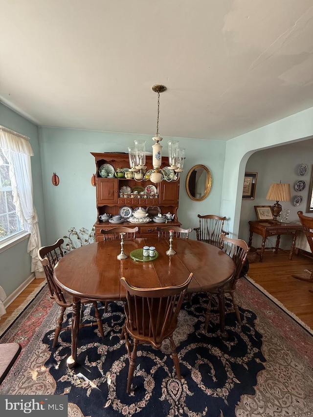 2703 Branch Pike, Cinnaminson, NJ 08077 - dining room featuring arched walkways, wood finished floors, and a notable chandelier