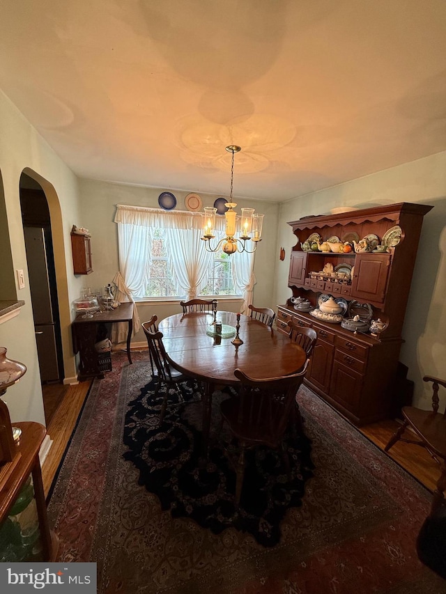2703 Branch Pike, Cinnaminson, NJ 08077 - dining space featuring a chandelier, arched walkways, baseboards, and wood finished floors
