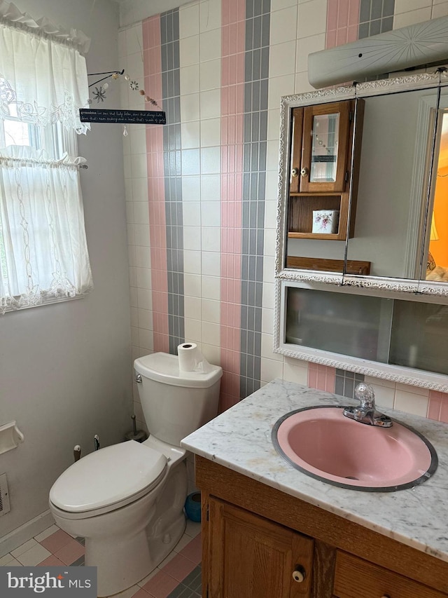 2703 Branch Pike, Cinnaminson, NJ 08077 - bathroom featuring toilet, tile patterned floors, vanity, and tile walls