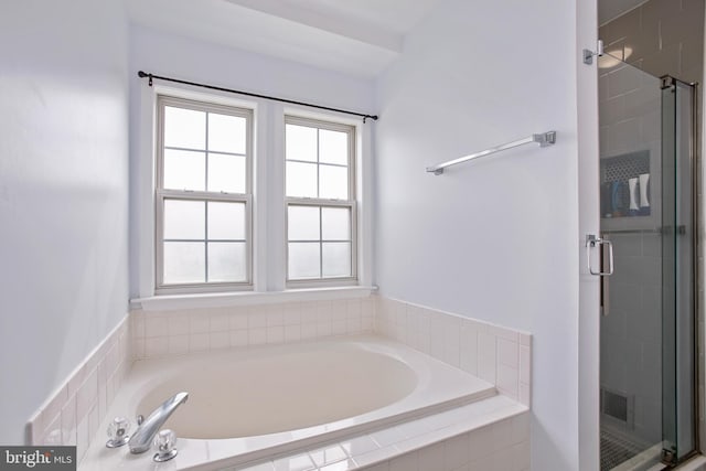 full bathroom featuring visible vents, a garden tub, and a shower stall