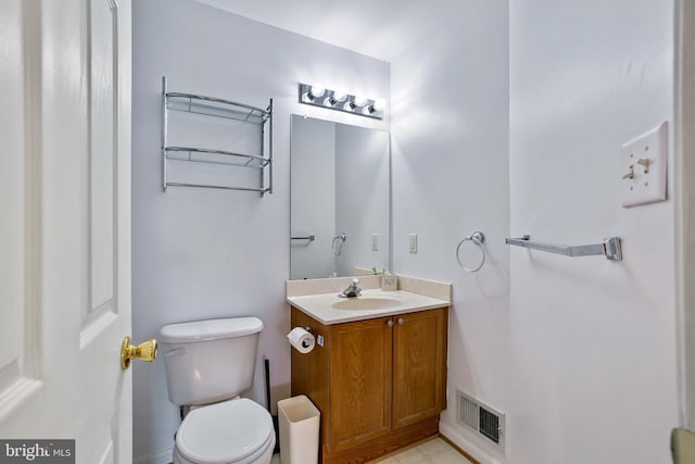 bathroom with visible vents, toilet, and vanity