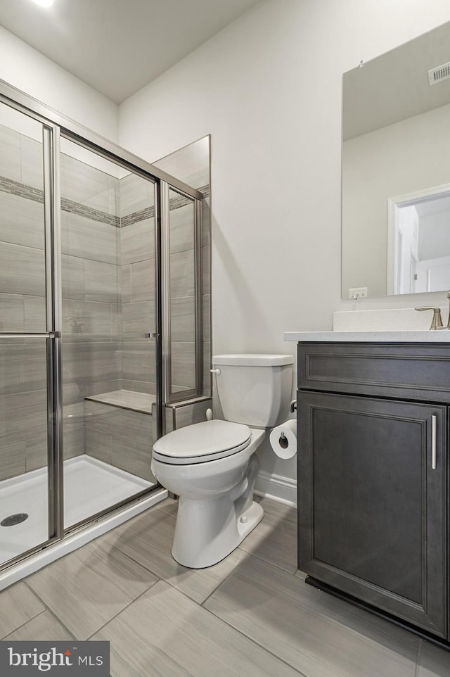 33273 Claremont Ct, Millsboro, DE 19966 - full bathroom featuring toilet, vanity, a stall shower, and visible vents