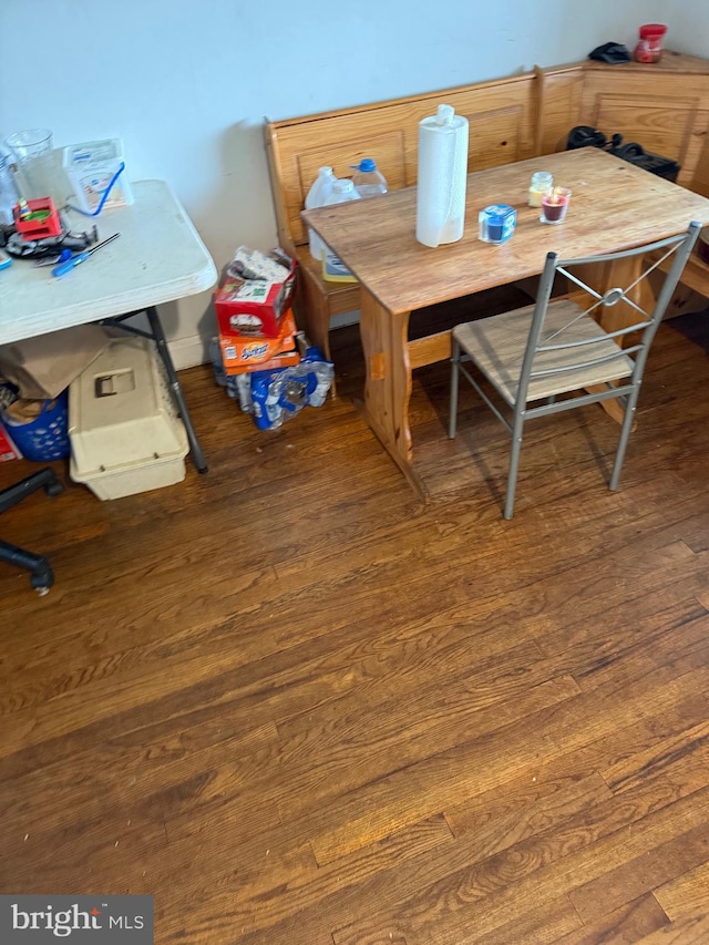 dining area with wood finished floors