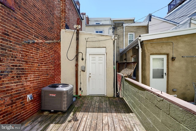 entrance to property featuring cooling unit