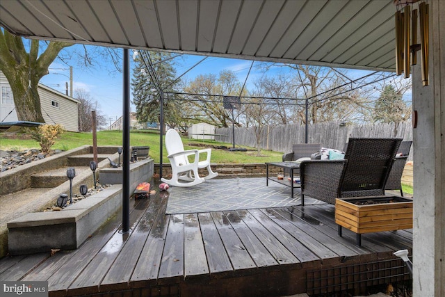 deck featuring a yard and a fenced backyard