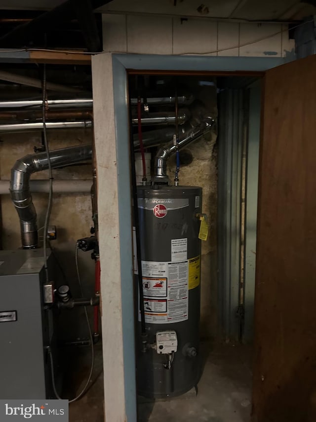 utility room with gas water heater