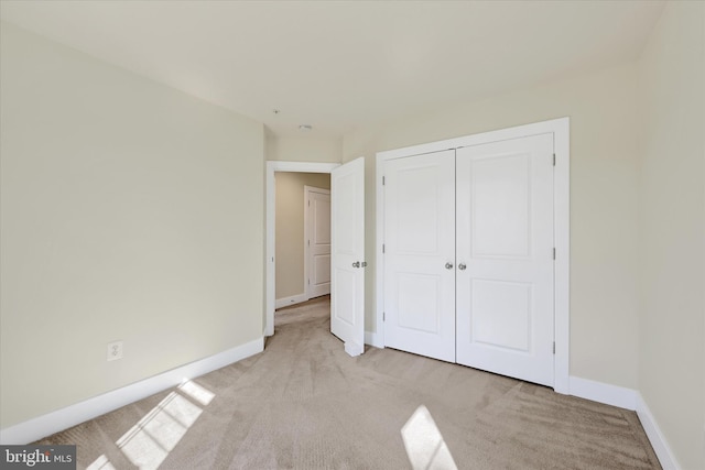 10031 Whitaker Way, Parkville, MD 21234 - unfurnished bedroom featuring baseboards, light carpet, and a closet