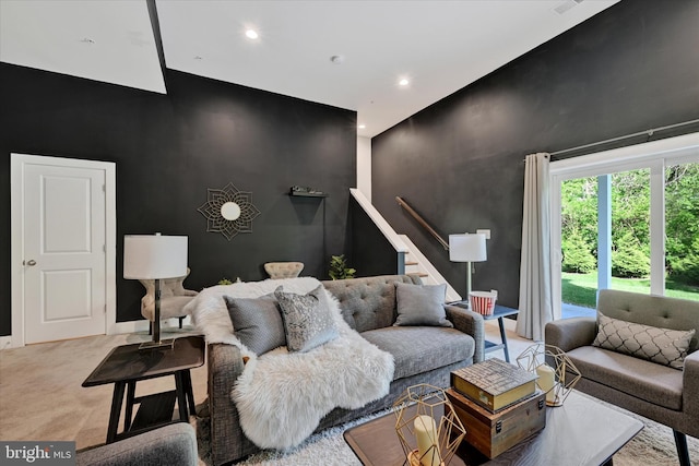 10031 Whitaker Way, Parkville, MD 21234 - living room featuring an accent wall, light carpet, recessed lighting, and a high ceiling