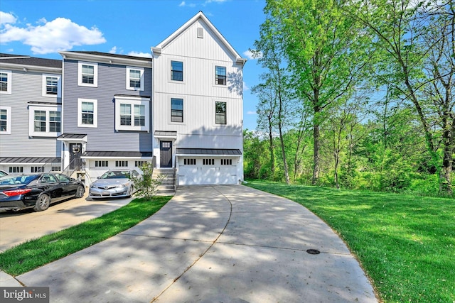 10031 Whitaker Way, Parkville, MD 21234 - townhome / multi-family property with an attached garage, a front yard, concrete driveway, a standing seam roof, and metal roof