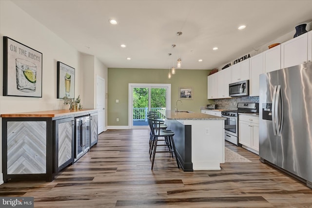 10031 Whitaker Way, Parkville, MD 21234 - kitchen with recessed lighting, white cabinetry, a sink, dark wood finished floors, and appliances with stainless steel finishes