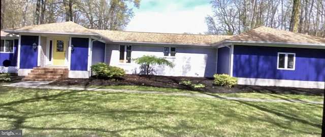 ranch-style home with a front yard
