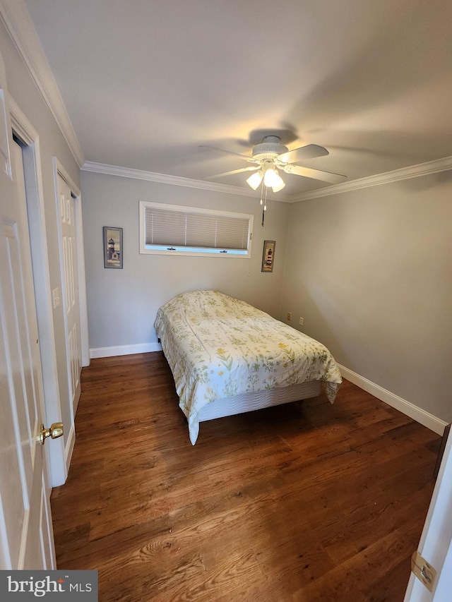 bedroom with dark wood finished floors, ceiling fan, baseboards, and ornamental molding