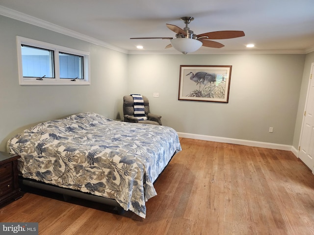 bedroom featuring ornamental molding, baseboards, recessed lighting, and wood finished floors